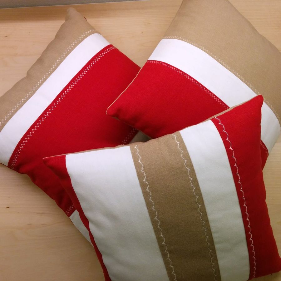 Three pillows, each striped differently