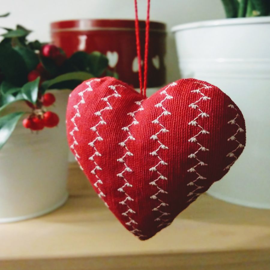 Quilted red heart hanging on a ribbon